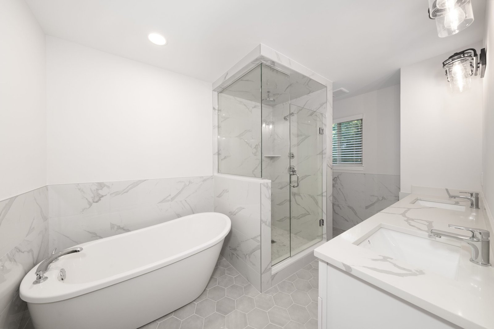 Modern white bathroom with a updated vanity.